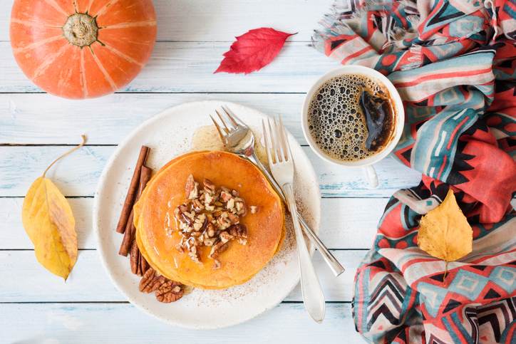 Pumpkin pancakes with pecan nuts and honey